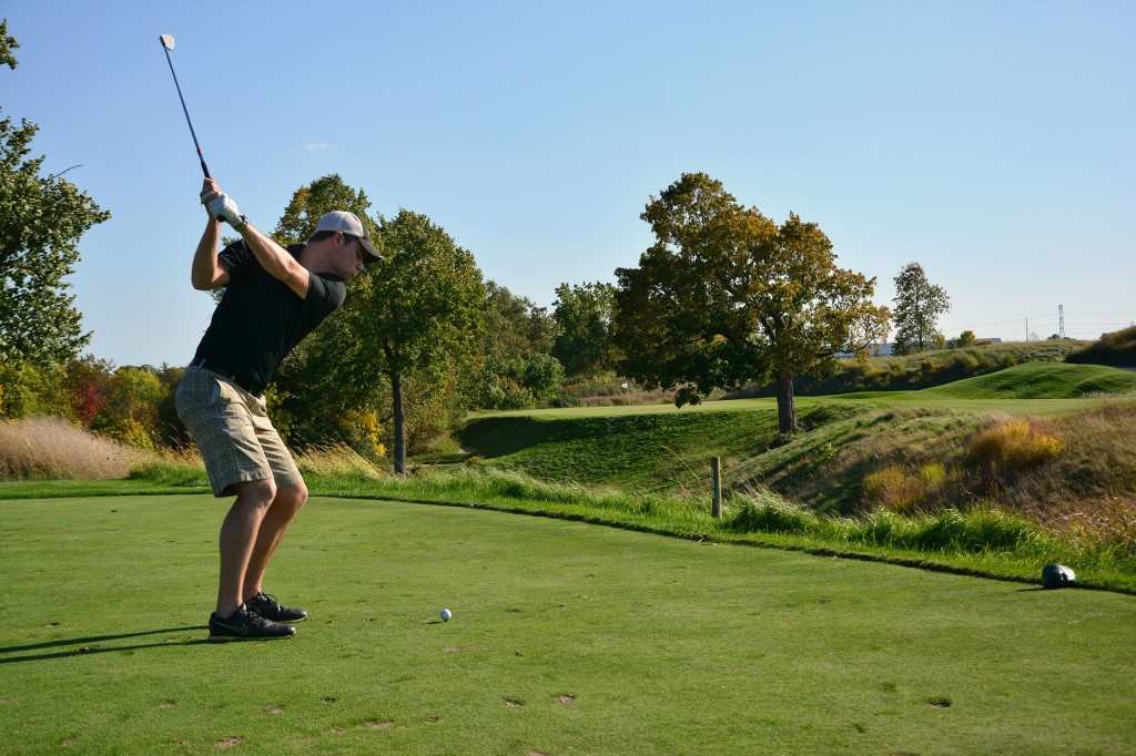 Sean Ogle teeing off on the 17th hole on the Meadow Valleys Course at Blackwolf Run
