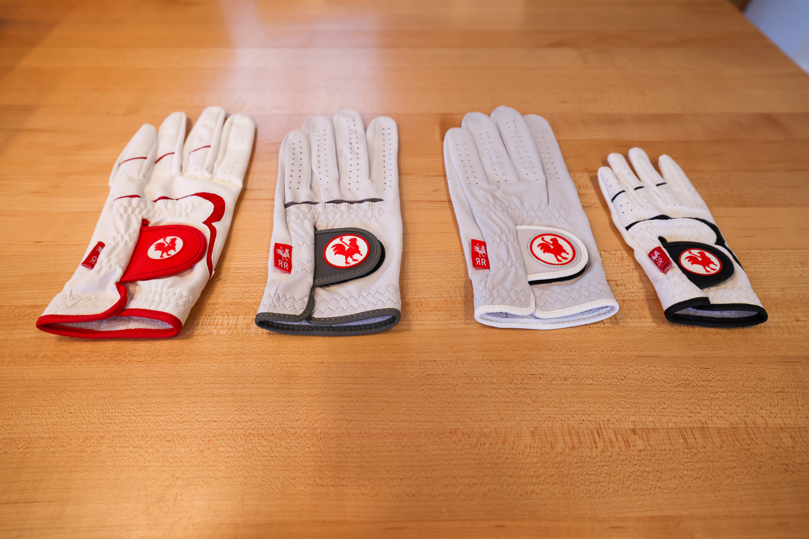 A collection of Red Rooster golf gloves.