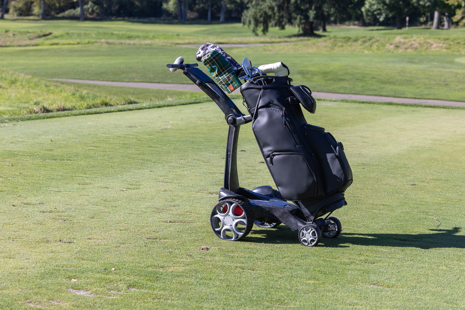 Stewart Golf Q-Follow Electric Caddie with cart bag on it